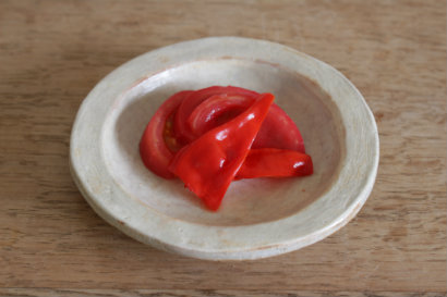 Pickled tomatoes and red bell peppers 